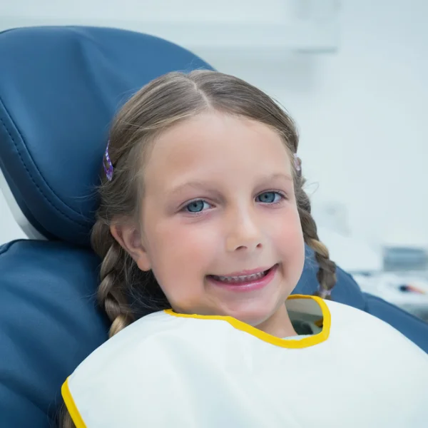 dentistry-children child smiling in dentist chair