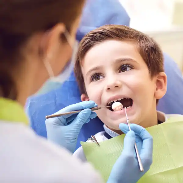 A child with a dentist in a dental office