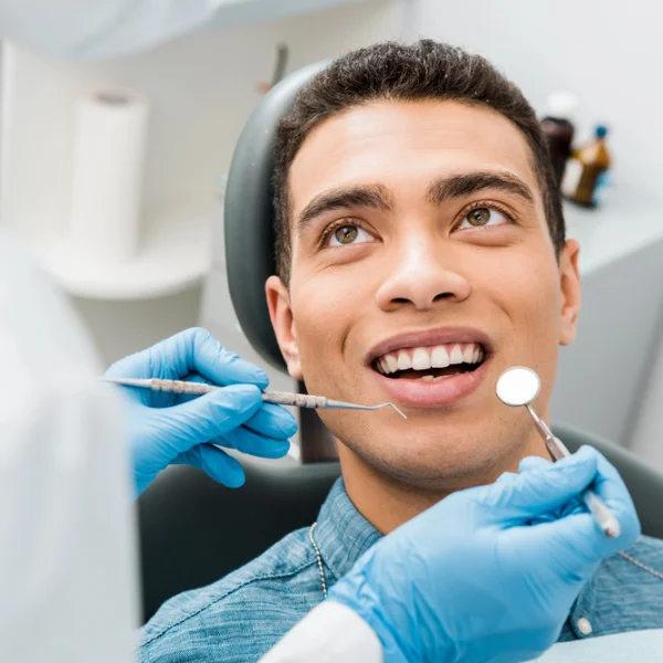 dental-examination man getting his teeth examination