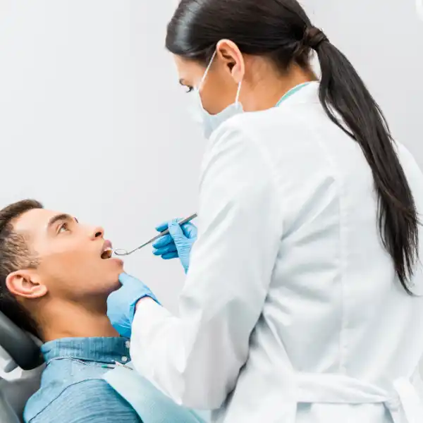 dental-teeth-cleaning man getting his teeth cleaned